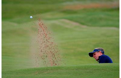 Luke Donald of England plays a shot from a bunker on the 4th at the 145th Open Championship at Royal Troon