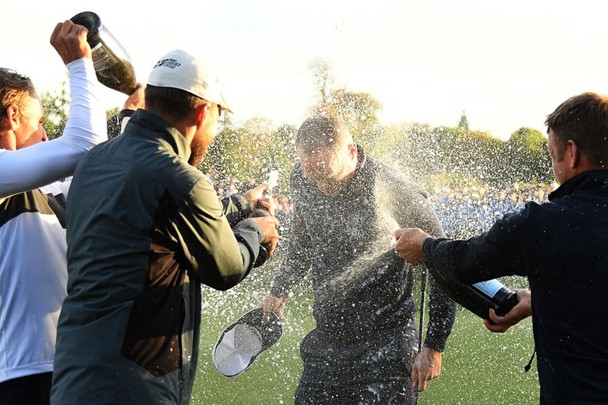 Alex Noren celebrates on the 18th green following British Masters victory