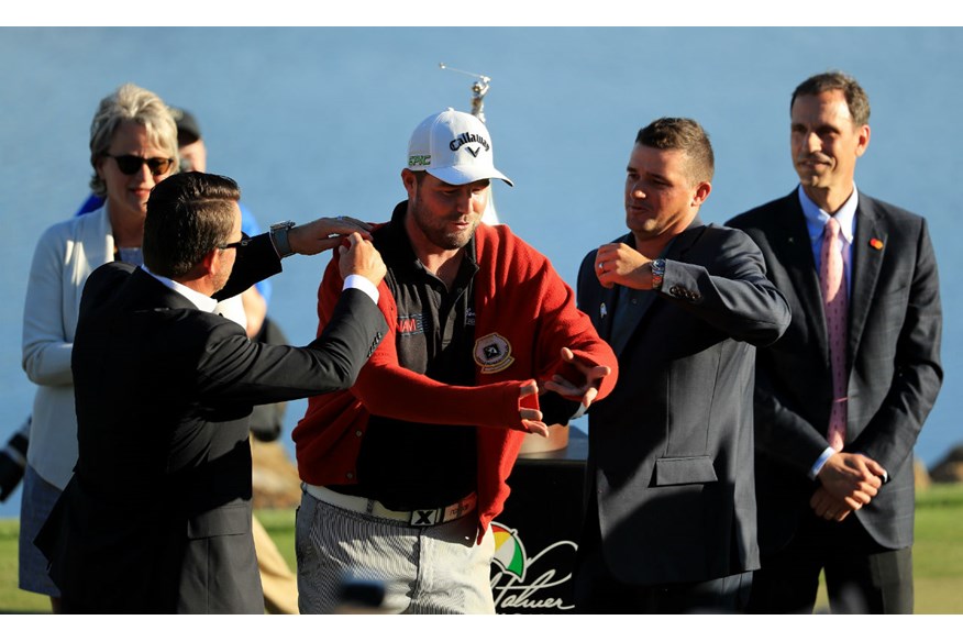 Marc Leishman presented with Arnold Palmer red cardigan