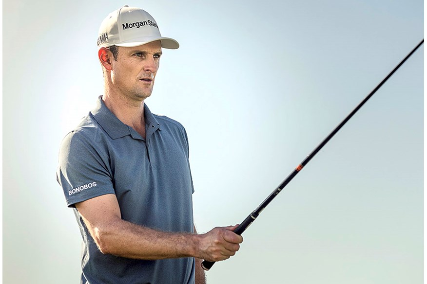 Justin Rose uses his club to pick a target.