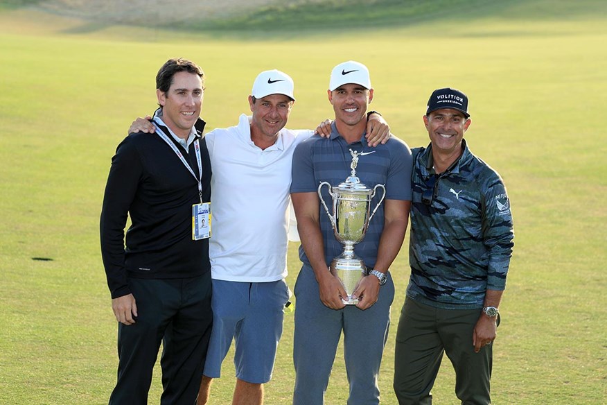 Koepka and Elliott celebrate defending the US Open in 2018.