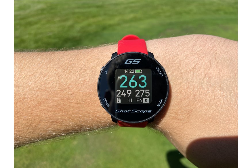 The Shot Scope G5 watch showing the yardage to the hole.