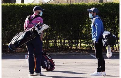 Golfers wearing masks due to Coronavirus