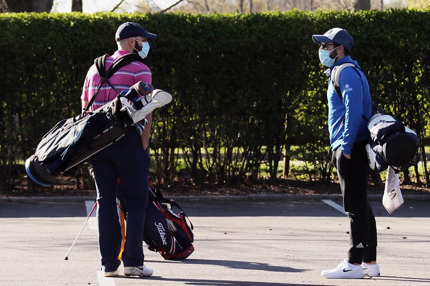 Golfers wearing masks due to Coronavirus