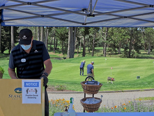 Golf club staff wearing masks to protect against Coronavirus