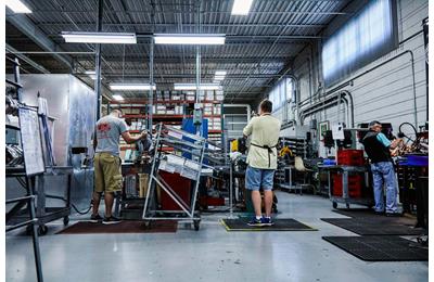 Wilson technicians put the finishing touches to new clubs.