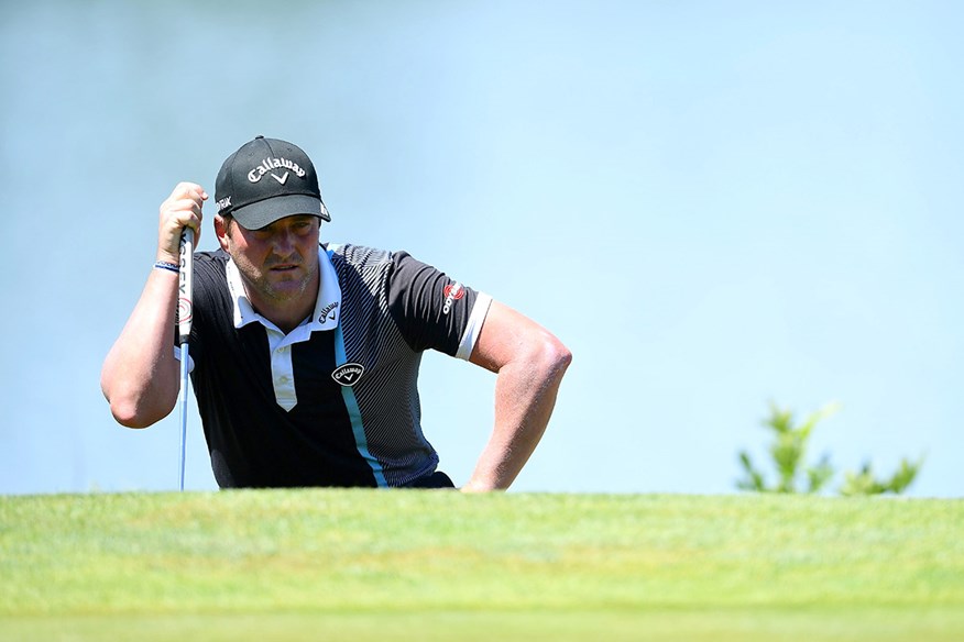 Marc Warren reads a putt