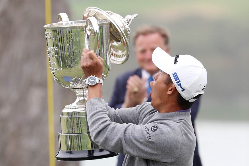 Collin Morikawa drops the Wanamaker Trophy lid at TPC Harding Park.