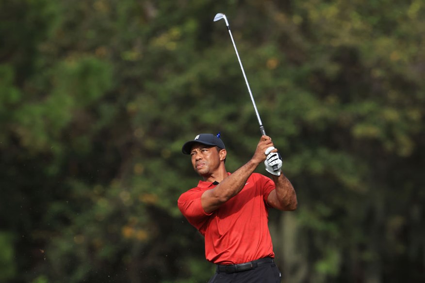 Tiger Woods with his TaylorMade P-7TW irons