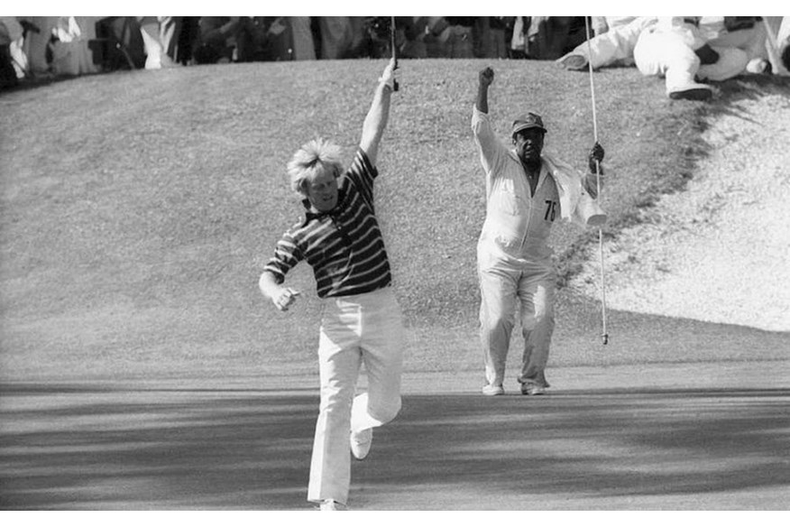 Jack Nicklaus and caddie Willie Peterson celebrate.