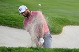 Jon Rahm playing out of the bunker