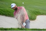 Jon Rahm playing out of the bunker