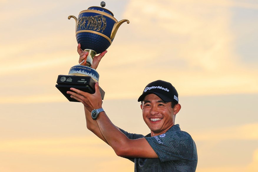 Collin Morikawa lifts the WGC-Workday Championship trophy.