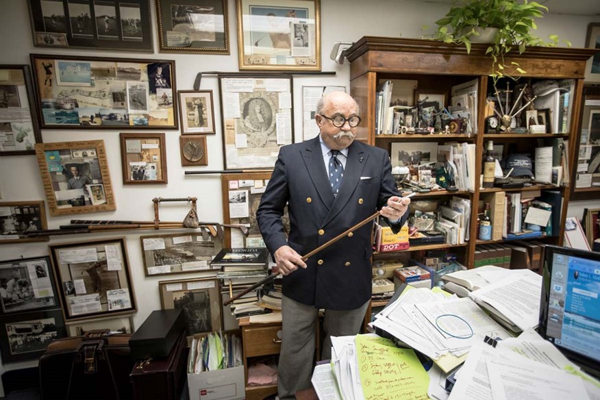 Sidney Matthew looks at one of Bobby Jones' golf clubs.