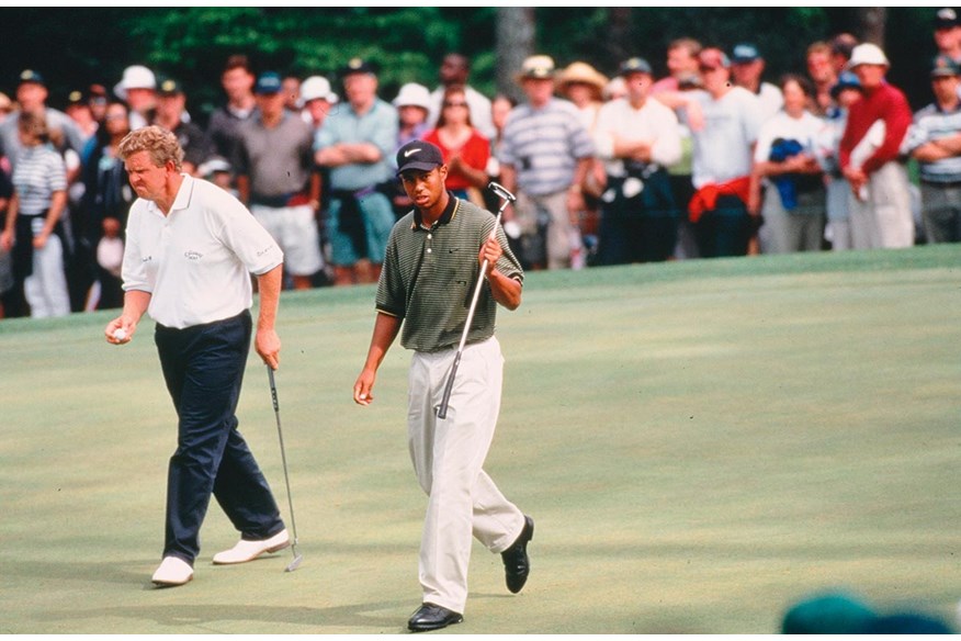 Tiger Woods acknowledges the crowds as he blows Colin Montgomerie away in the third round of the 1997 Masters.