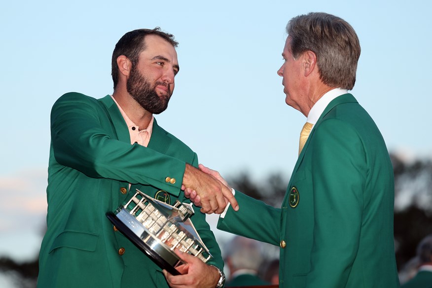 Scottie Scheffler is congratulated by Masters chairman Fred Ridley.