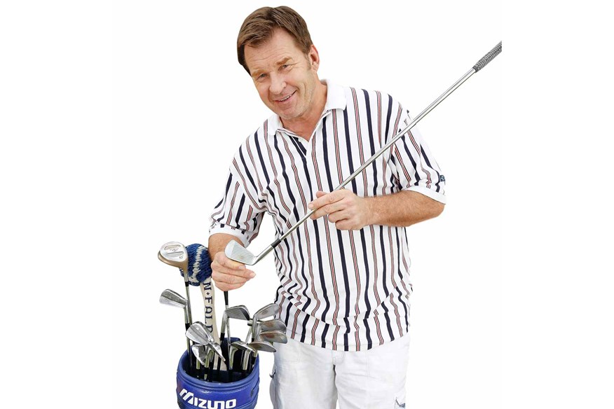 Nick Faldo with the 2-iron that helped him to victory in 1996.