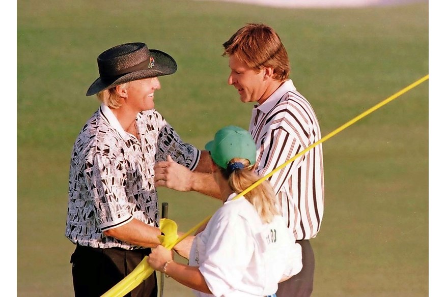 Nick Faldo consoles Greg Norman after winning the 1996 Masters.