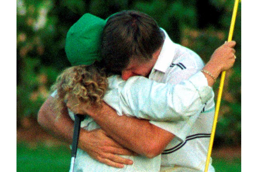 Faldo celebrates with caddie Fanny Sunesson in 1990.