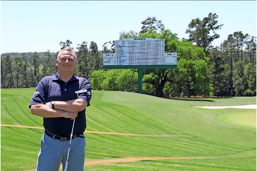 Nick Wright in front of one of Augusta's Masters leaderboards.