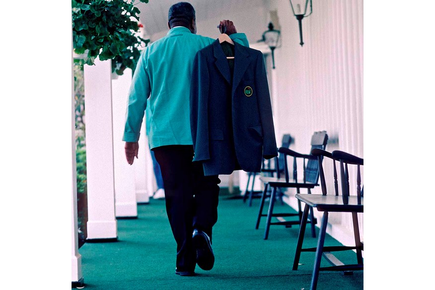 A Green Jacket is carried through Augusta National.