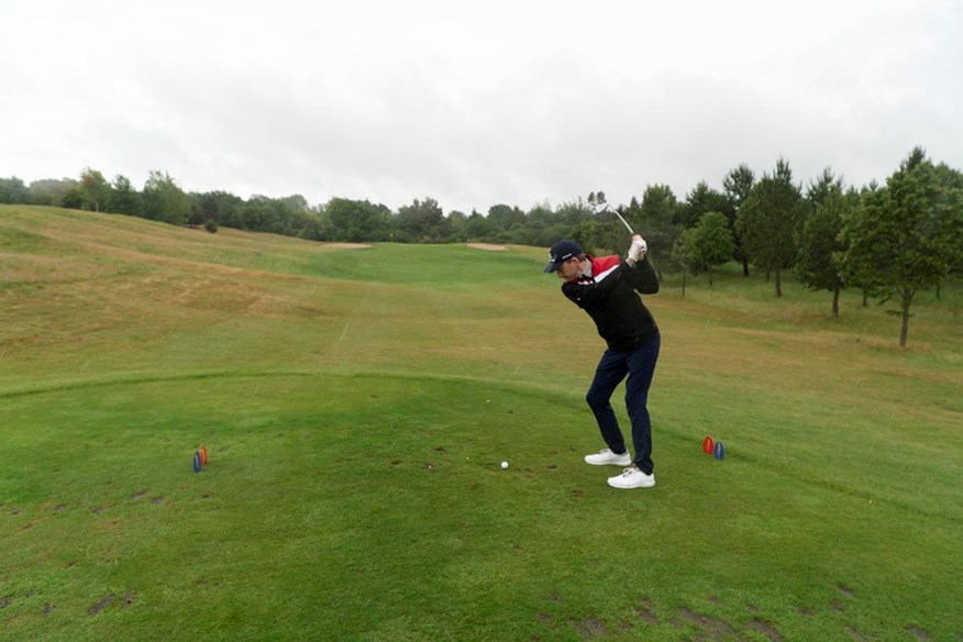 John Robins hits a tee shot at The Shire.