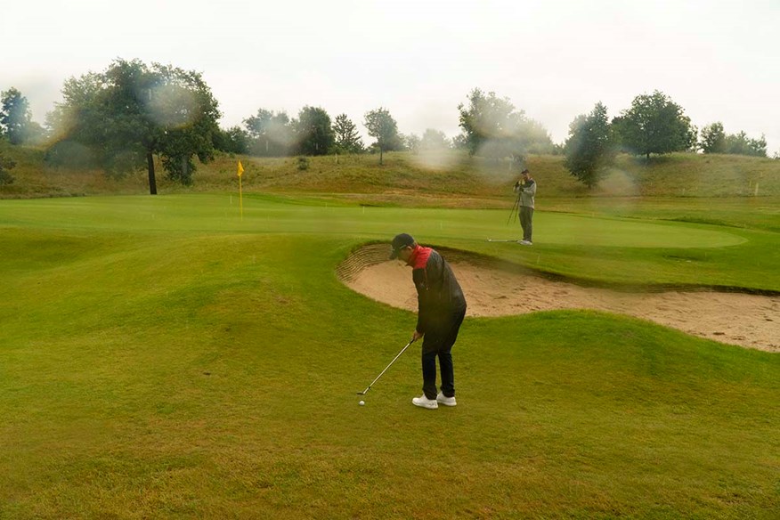 John Robins filming in the rain with Bad Golf co-creator Alex Horne.