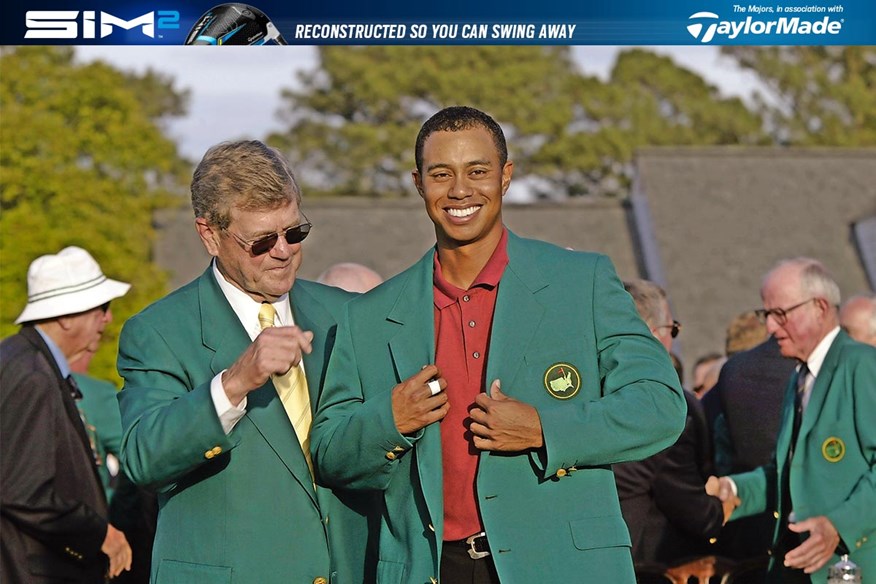 Tiger Woods puts on the Green Jacket after winning the 2002 Masters.