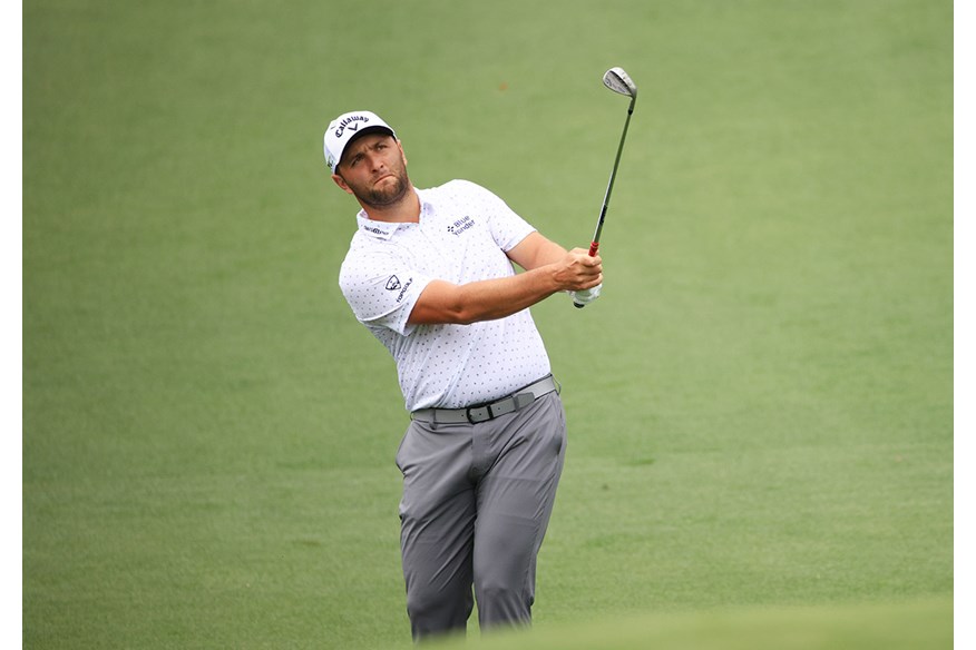 Jon Rahm plays a pitch shot.