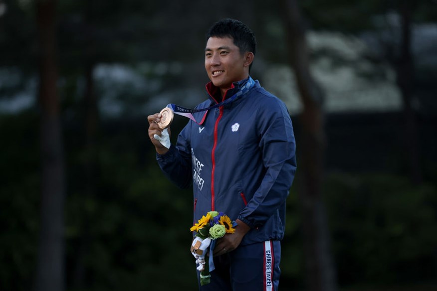 C T Pan with his bronze Olympic Golf medal.