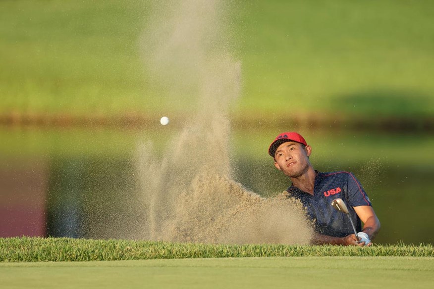 Collin Morikawa splashes out of the bunker on the fourth play-off hole, but he couldn't save his Olympic Golf bronze medal hopes.