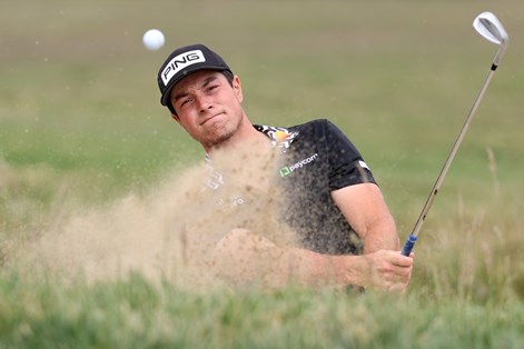 Viktor Hovland playing out the sand.