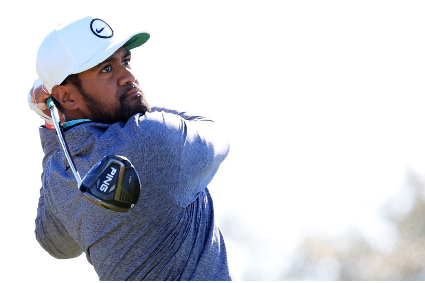 Tony Finau posing after his tee shot.