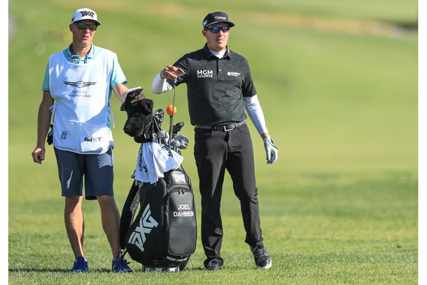 Joel Dahmen's caddie Geno Bonnalie (left) holds the current record for most golf holes played in seven days.