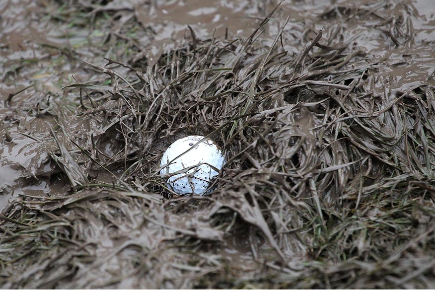 Plugged lies and wet conditions are common parts of winter golf.