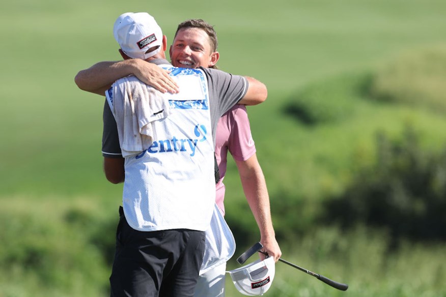 Cameron Smith celebrating the W with his caddie.