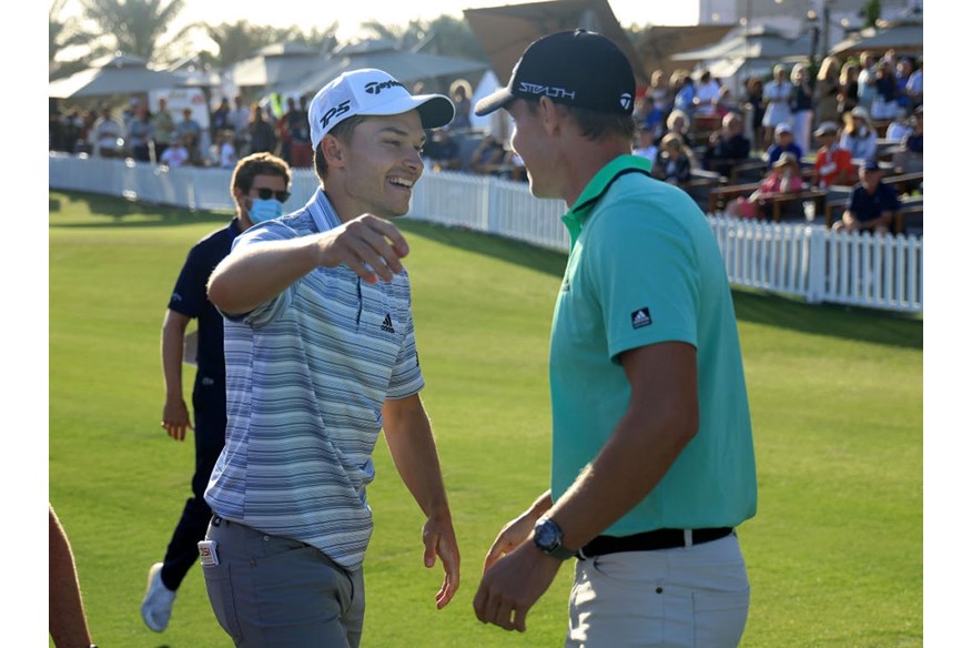 Nicolai Hojgaard is congratulated on his Ras al Khaimah victory by twin brother Rasmus.