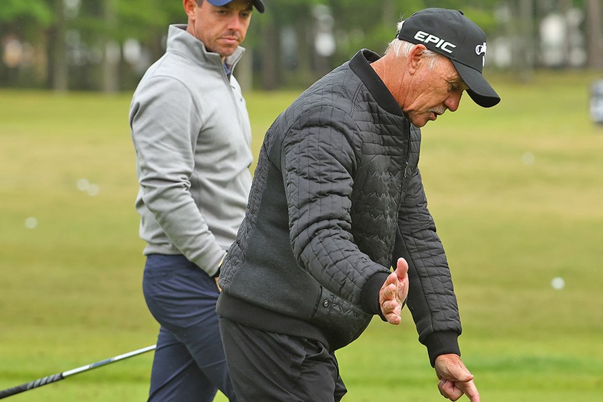 Pete Cowen gives Rory McIlroy some guidance on the range.